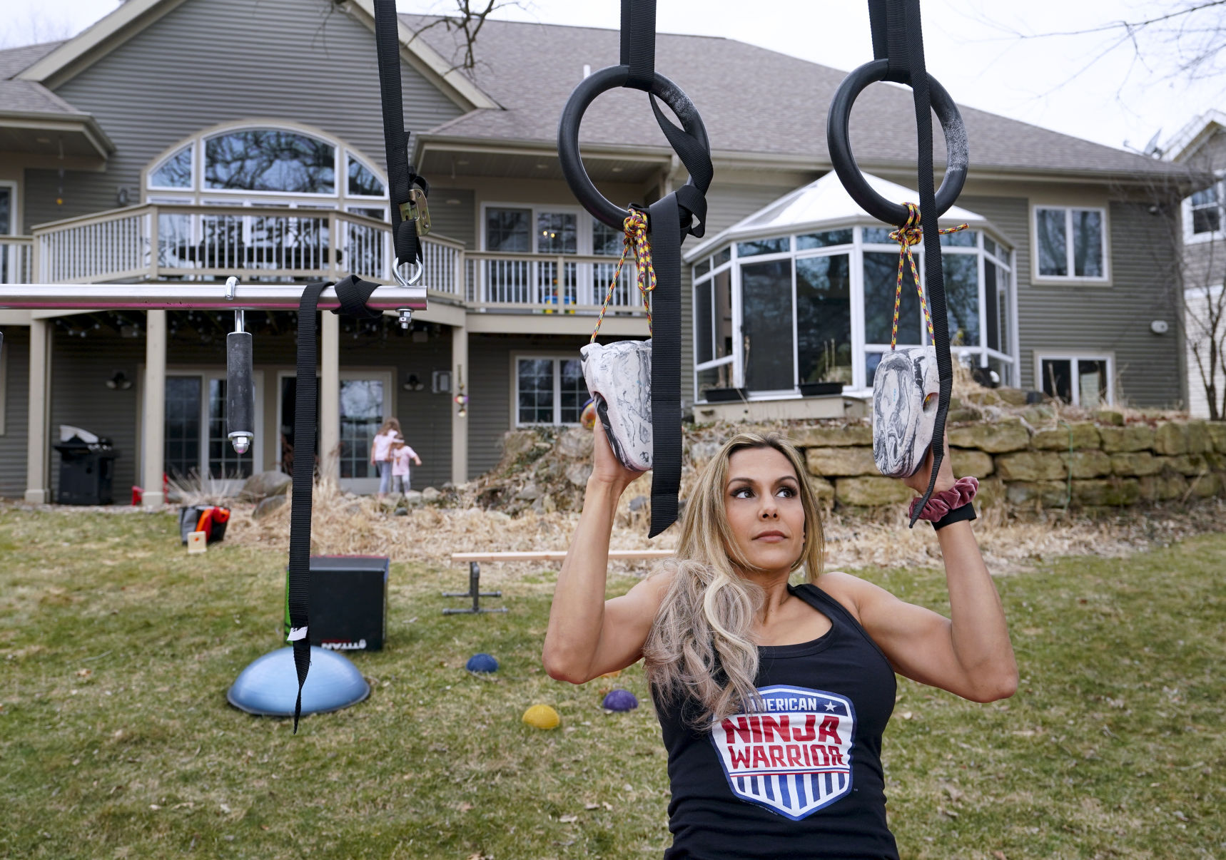 Yarizett Breunig with rings in back yard gym area